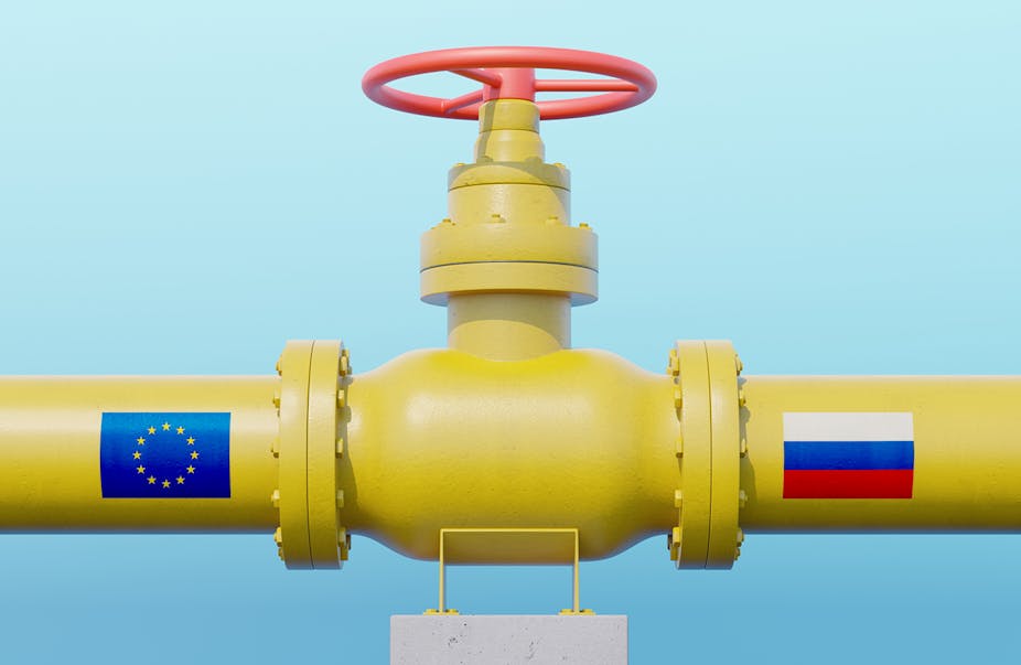 Gas pipeline valve with European Union flag and Russian flag. 