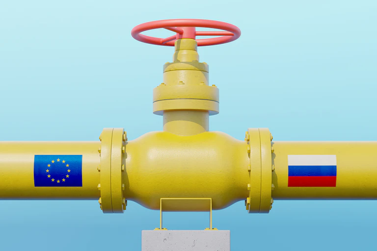 Gas pipeline valve with European Union flag and Russian flag.