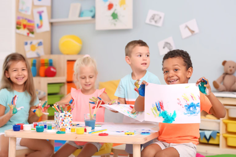 Four children finger painting