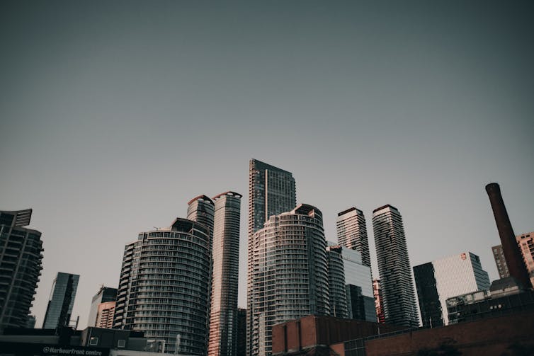 a photograph of several high-rise condo towers