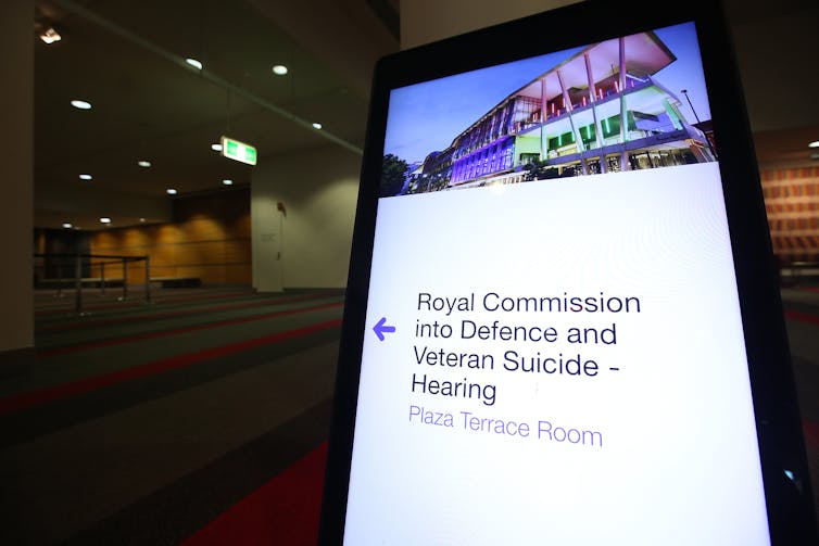 Sign showing the way to the royal commission hearing.