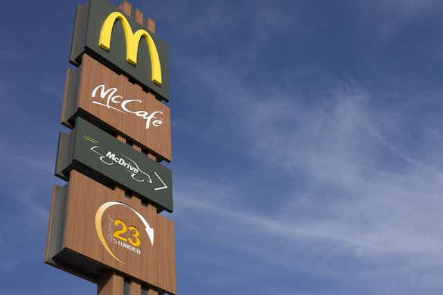 A series of signs for McDonalds services