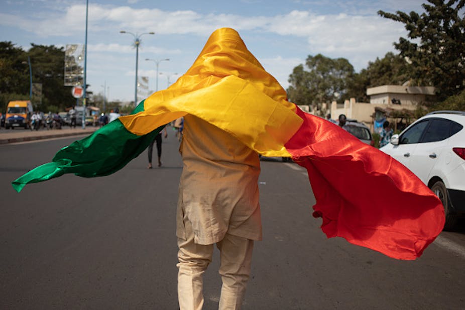 A man draped in Mali's flag