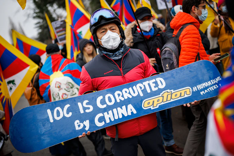 A man protests the Olympics being held in China due to human rights abuses there.