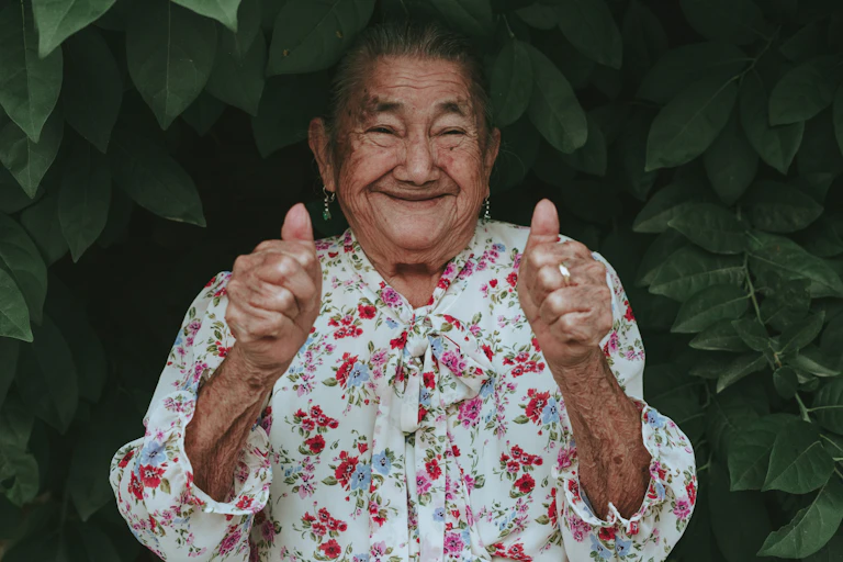 Old lady with two thumbs up