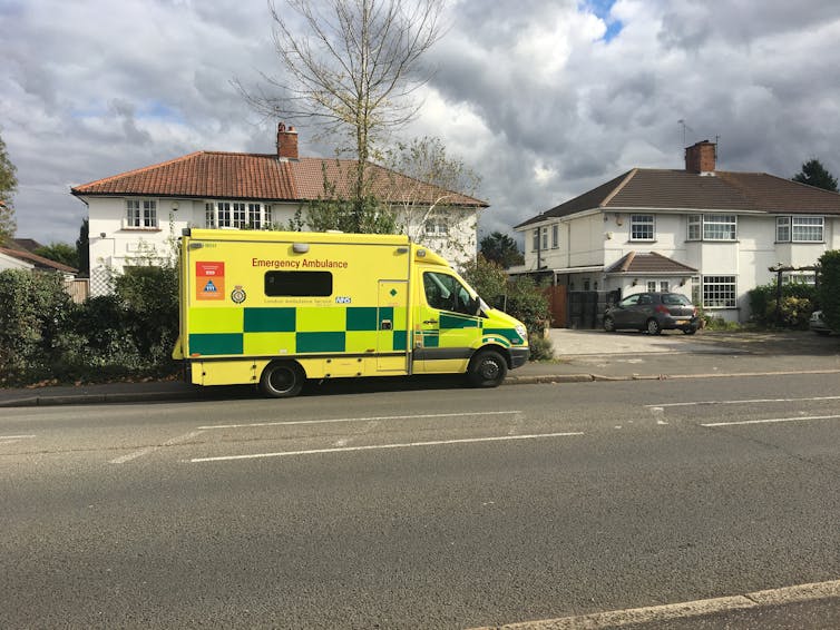 An ambulance parked on a residential street
