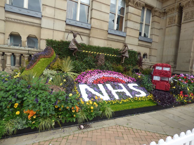 A floral display featuring the letters NHS