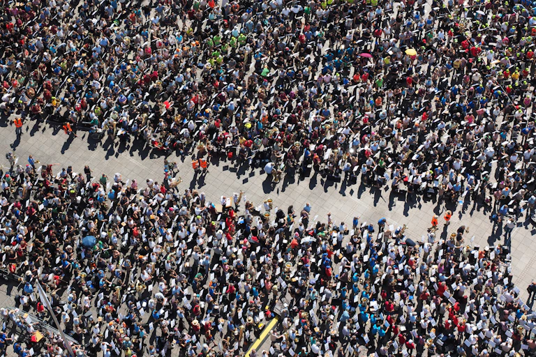 A crowd of people separated in the centre
