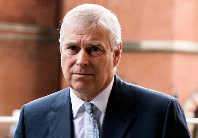 Close-up of Prince Andrew wearing a dark blue suit