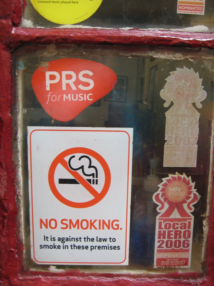 A no-smoking sign in a window