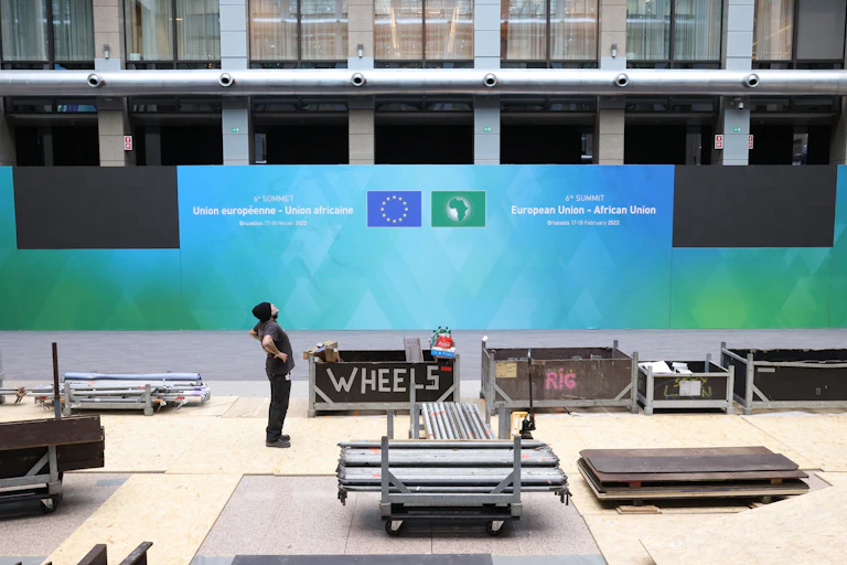 A worker prepares the stage for the EU-AU summit.