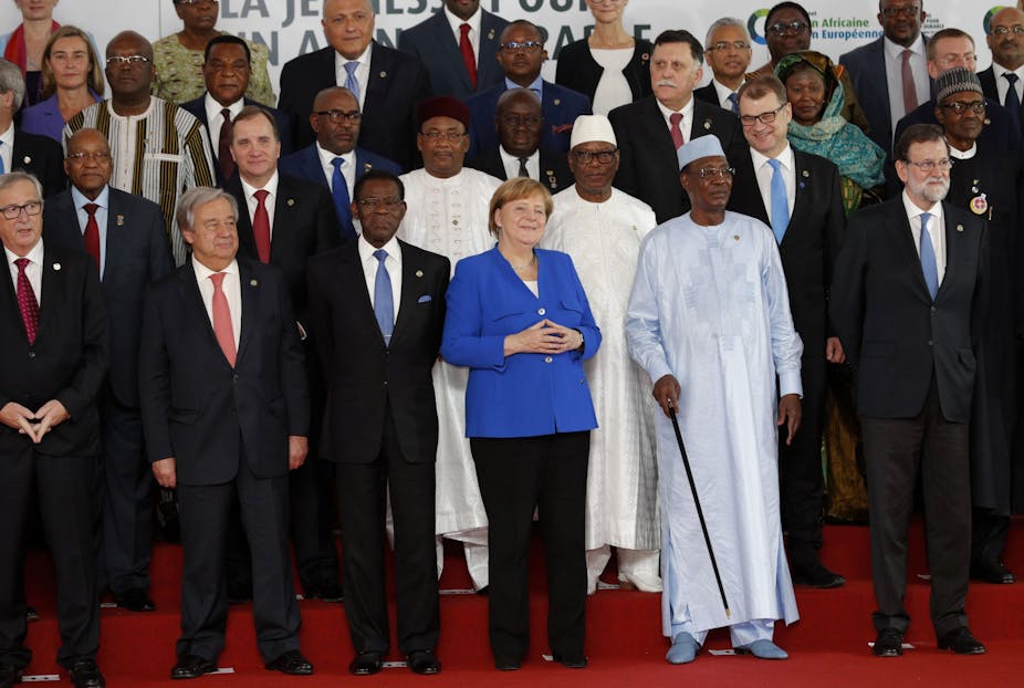 Africa’s relations with the EU: a reset is possible if Europe changes its attitude", na The ConversationA group of people stand on a red carpet in front of signage; some wearing suits, others in robes