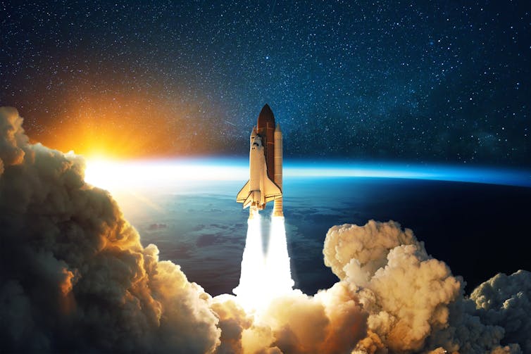 Space shuttle leaves earth's atmosphere