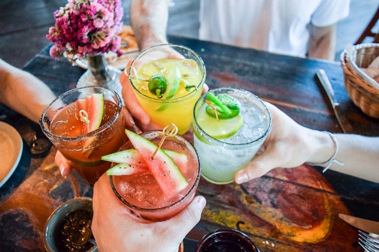 Four different cocktails of different colours.