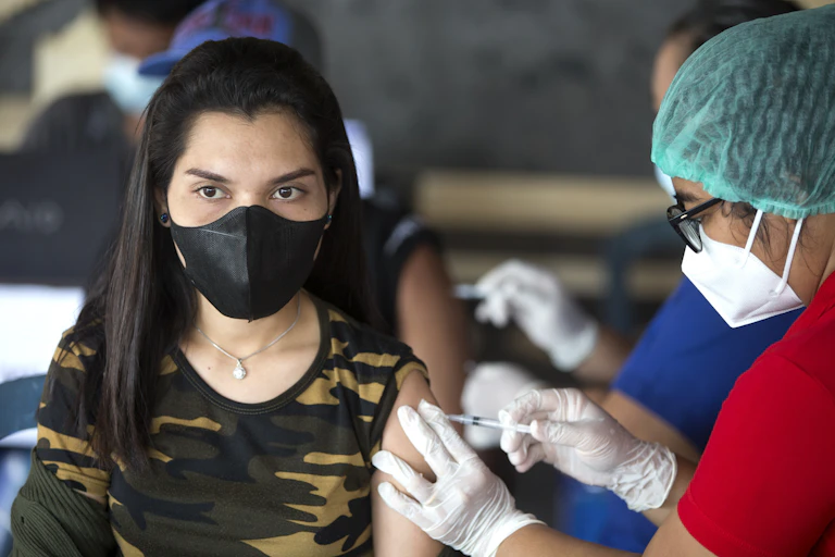 Person getting a COVID vaccine dose