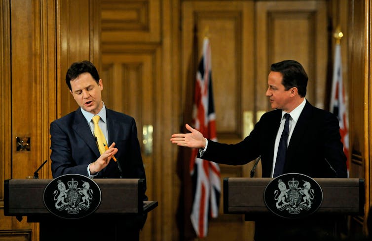 David Cameron pointing to Nick Clegg at a joint press conference