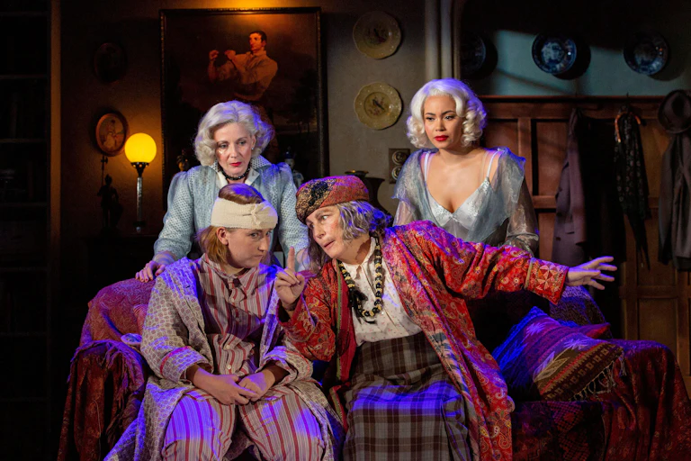 four actors perform on stage