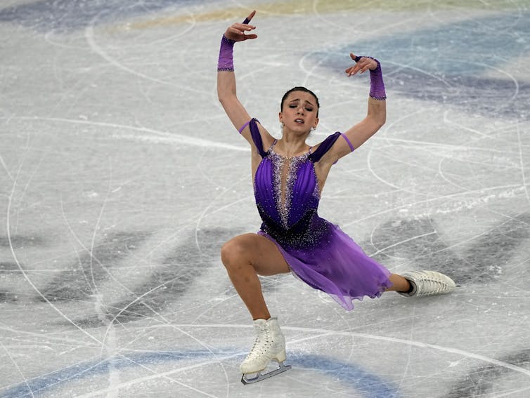 A figure skater in a purple dress
