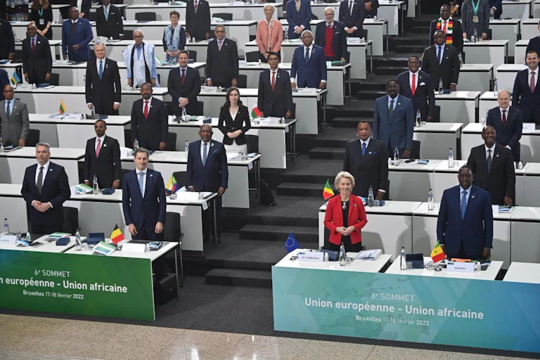 Men and women standing in a room