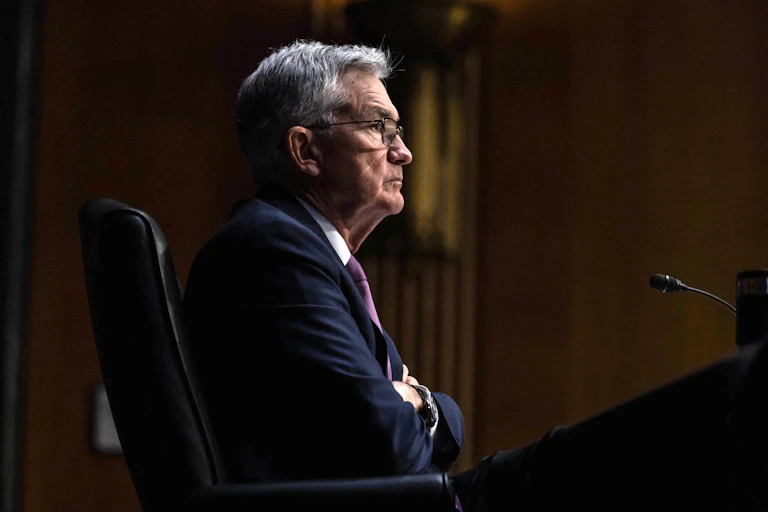 Jerome Powell with his arms folded