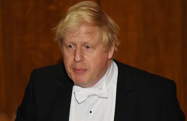 Boris Johnson wearing white tie. 