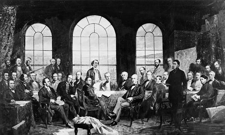 A photograph of a painting of a group of men sitting in a meeting room.