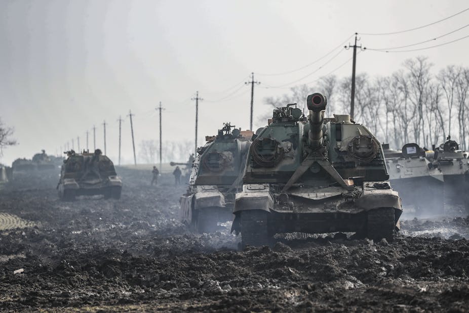 Russian tanks moving through mud