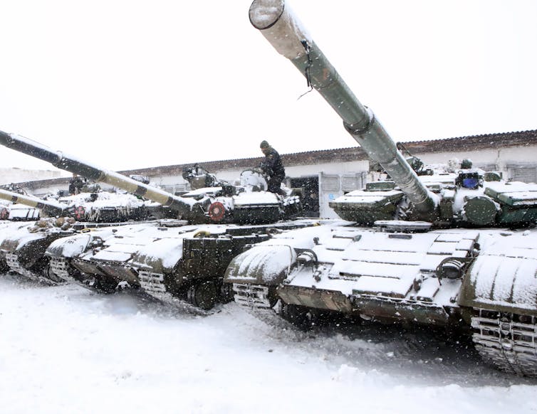 Soldiers with the 92nd Mechanized Brigade of the Ukrainian Armed Forces conduct drills in tanks in northeastern Ukraine on Jan. 31, 2022. 