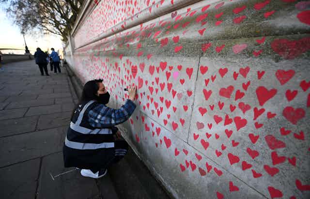 Volunteer working on National Covid Memorial Wall in London