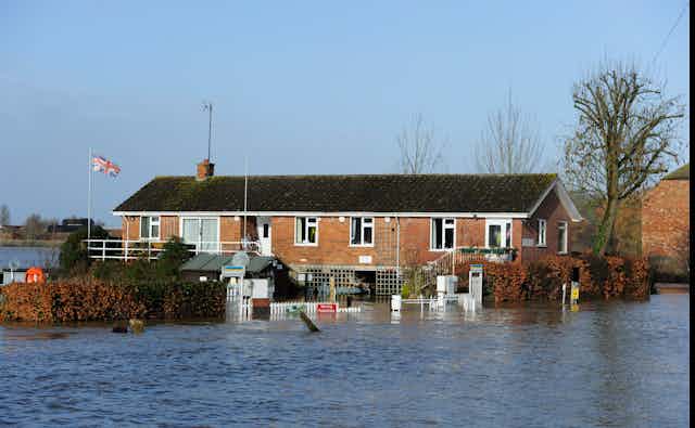 bungalow surrounded by flood water