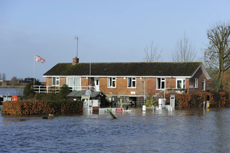 bungalow surrounded by flood water