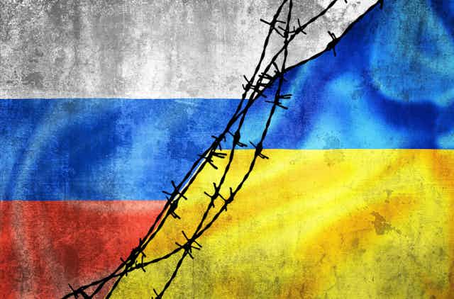 Artwork of Russian and Ukraine flags with barbed wire.