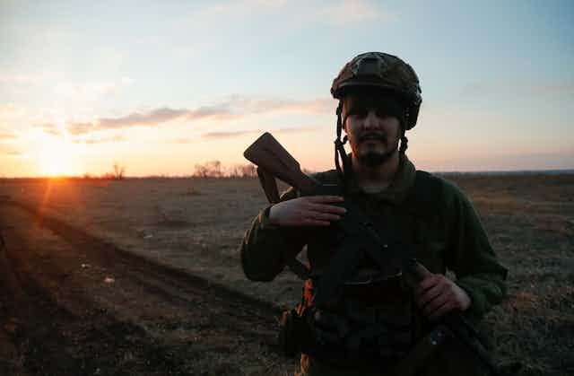 A Ukranian soldier keeps watch.