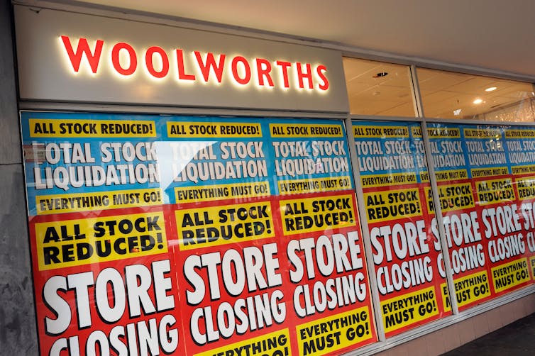 Shop window closing down signs.