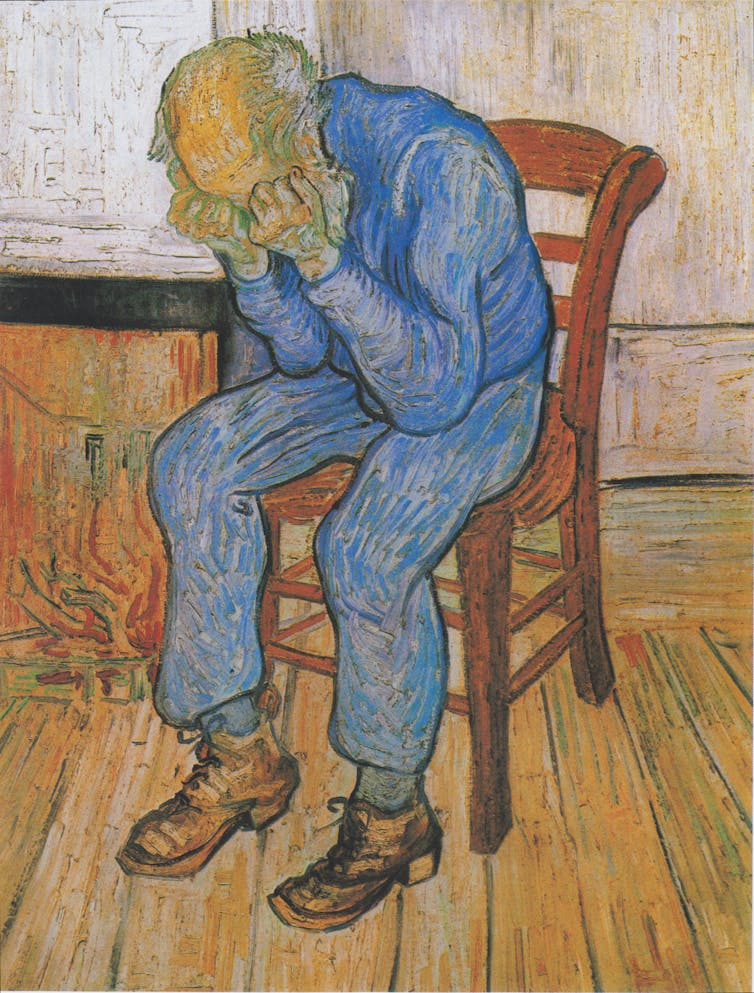 Van Gogh painting of an old man sitting alone in a room with his head in his hands.