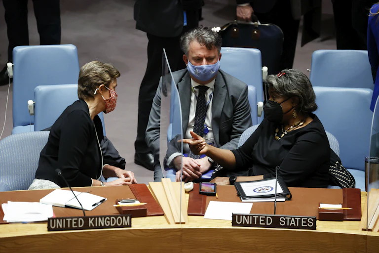 UK Ambassador to the United Nations Barbara Woodward (L) and US Ambassador to the United Nations Linda Thomas-Greenfield (R) talk to Ukraine Ambassador to the United Nations Sergiy Kyslytsya
