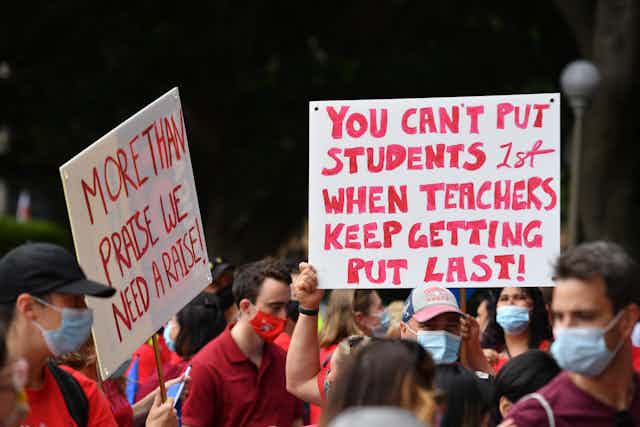 Signs at a rally of striking teachers