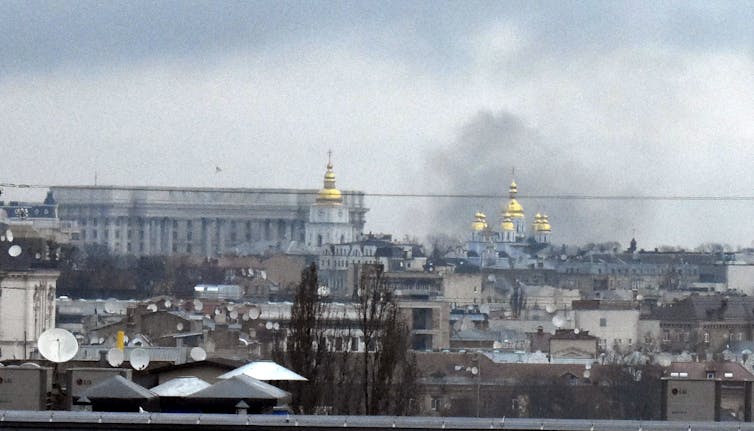 Black smoke rises into the air in Ukraine's capital Kyiv.