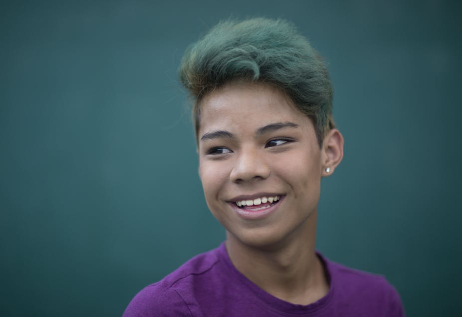 Portrait of smiling trans teen