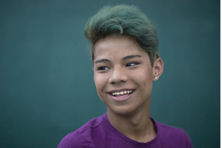 Portrait of smiling trans teen