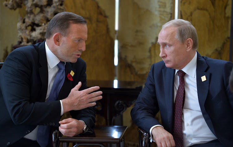 Australia's then prime minister Tony Abbott and Vladimir Putin talk at the Asia-Pacific Economic Cooperation (APEC) Summit in Beijing in November 2014.