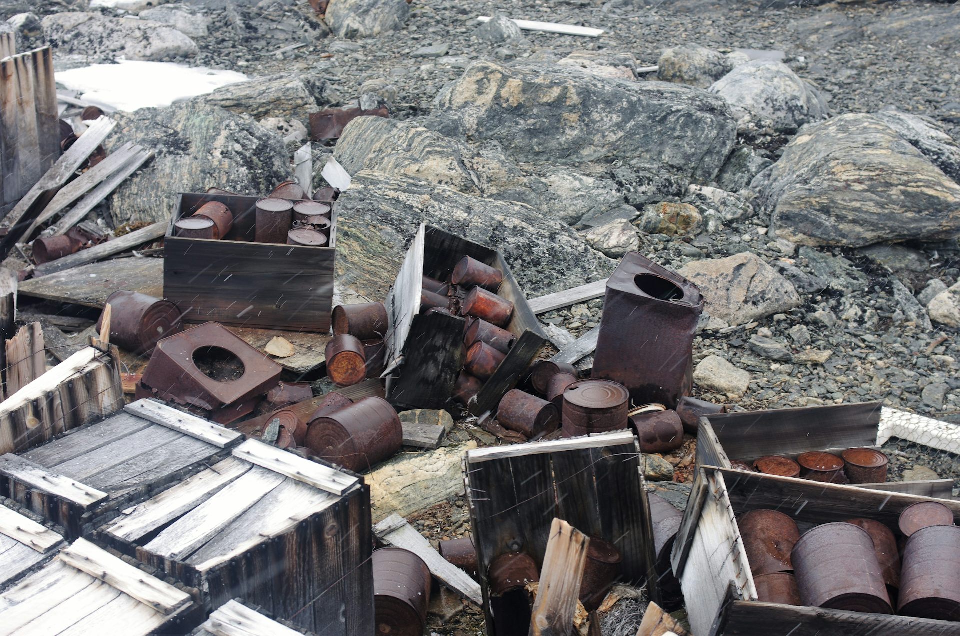 Wooden crates containing rusting tins of food abandoned at Wilkes Station