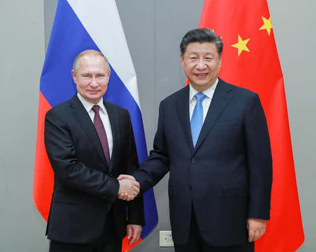 President Putin shaking hands with Chinese president Xi Jinping