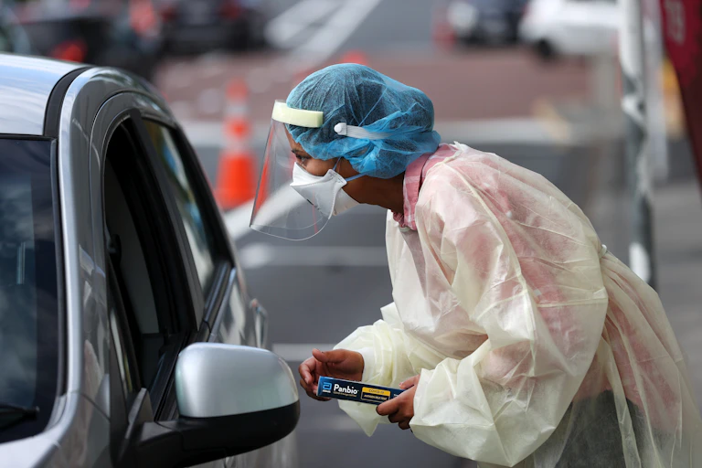 Nurse in protective gear at a COVID testing centre