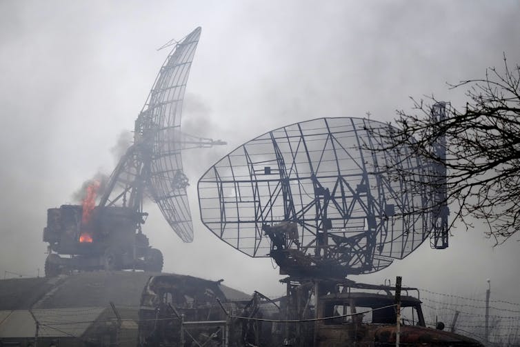 Damaged radar equipment at a military facility.