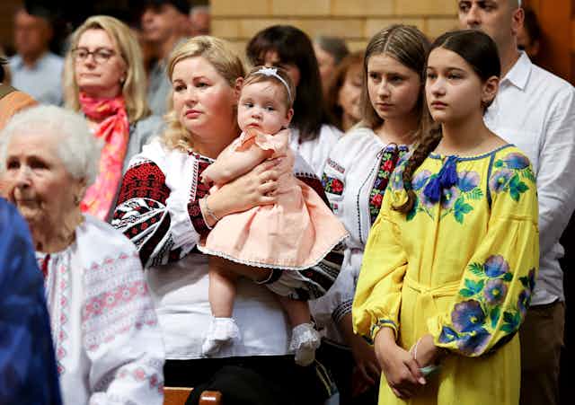 people gather in Ukrainian dressa