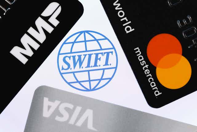 Swift symbol surrounded by credit card symbols