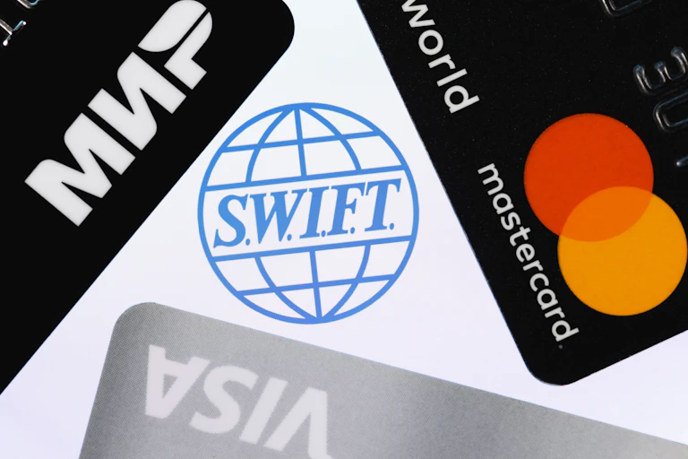 Swift symbol surrounded by credit card symbols