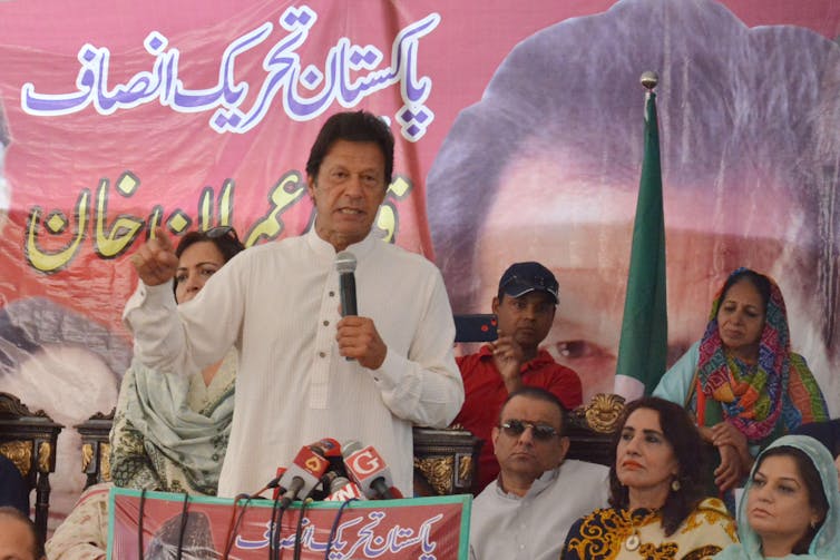 Prime minister Imran Khan addresses a crowd from the stage.