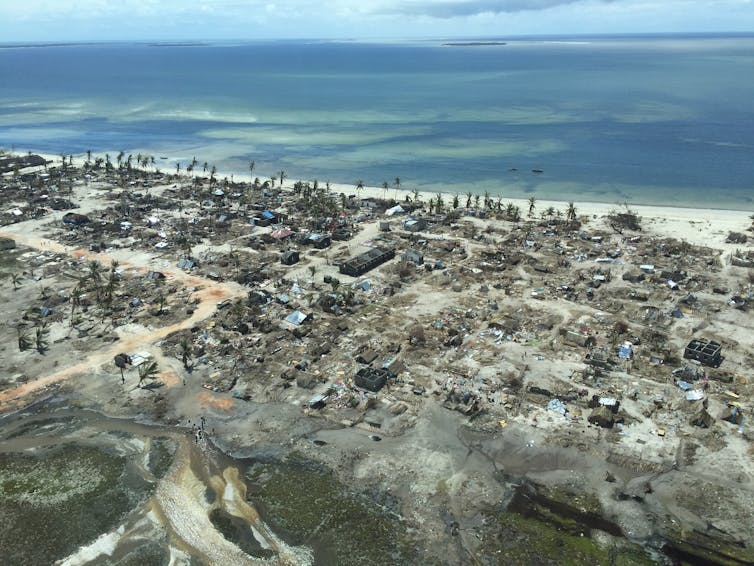 Badly damaged coastal village viewed from above